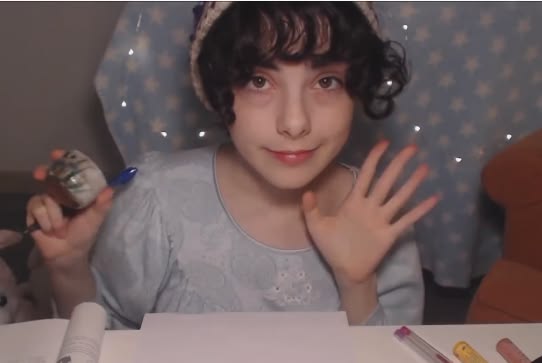 A person waving at the camera